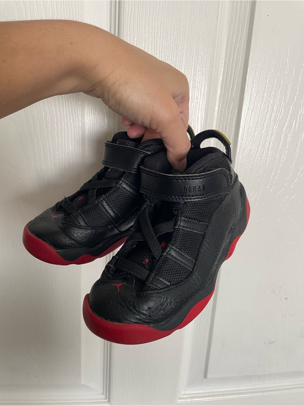 Toddler 10C Jordan 6 Rings TD Sneakers in Black and University Red.